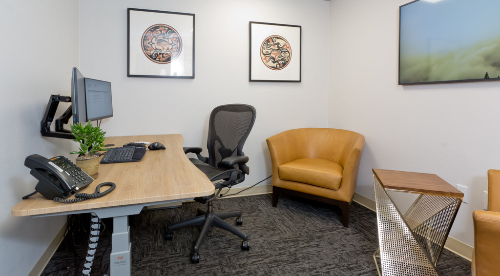 Woodgrain desktop with in office white wall