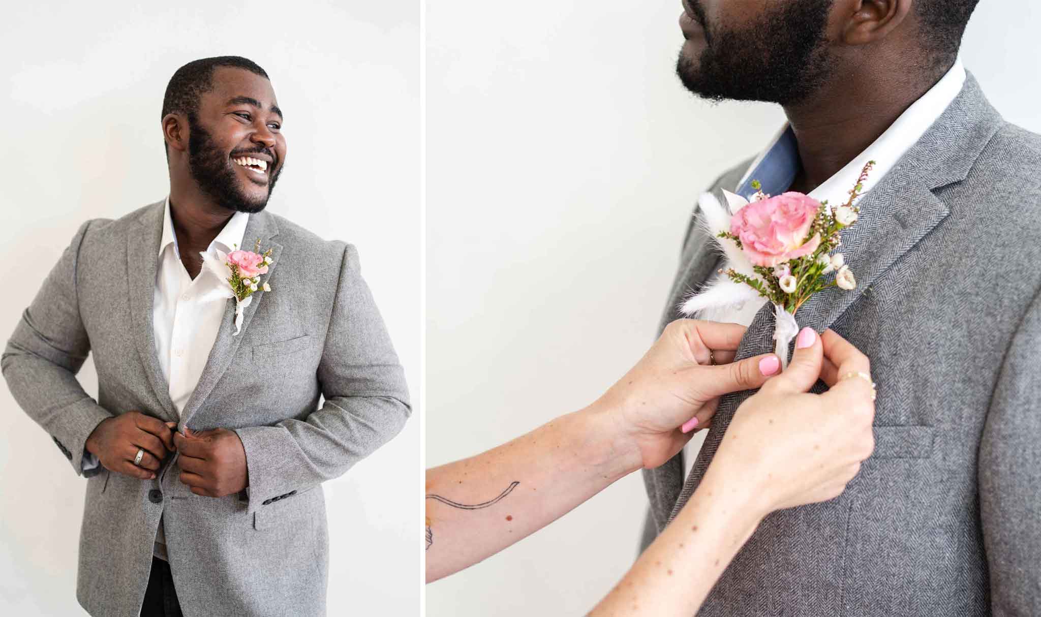 A man wearing a boutonnière on the lapel of a gray suit