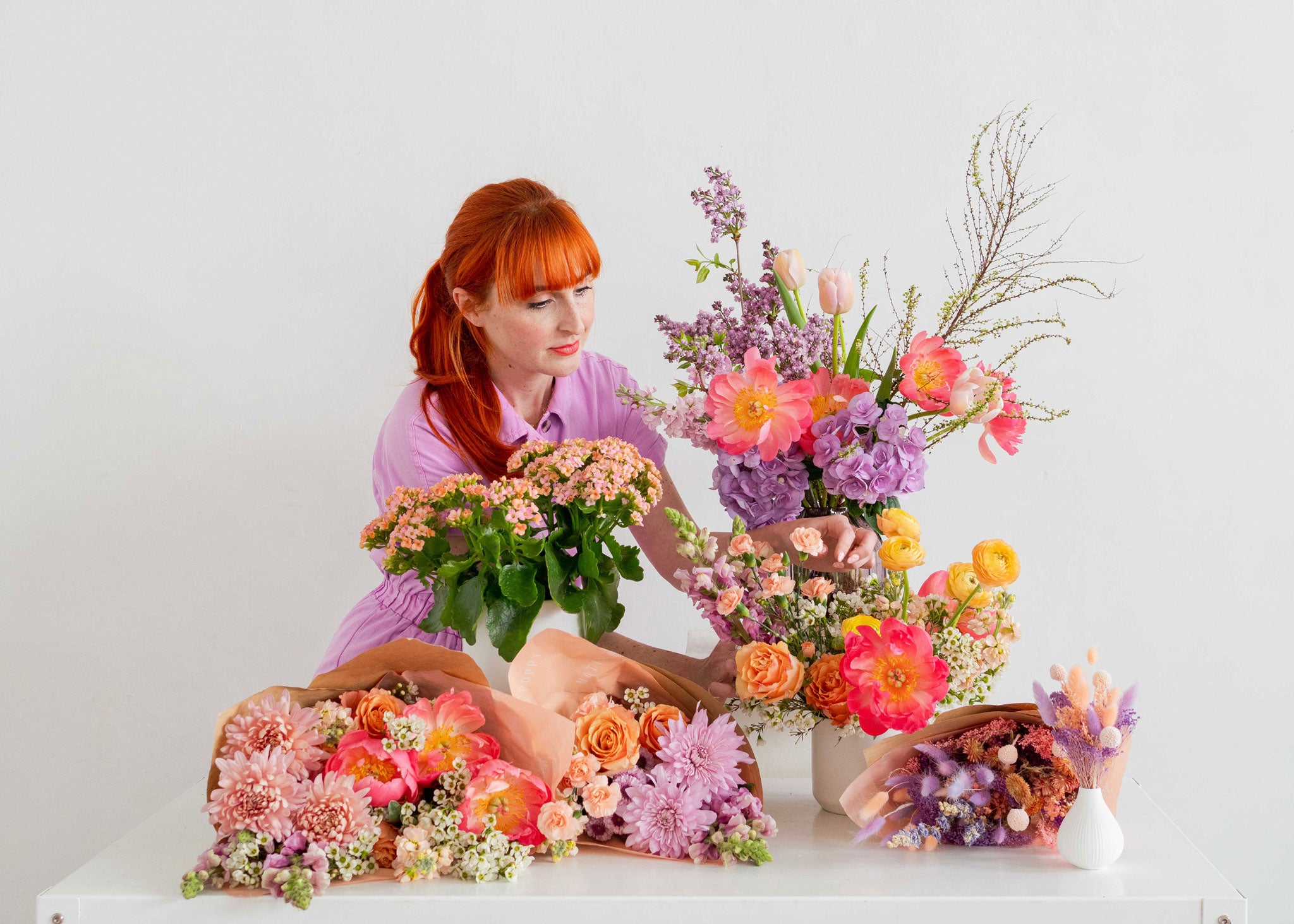 Florist arranging a group of Mother’s Day flowers
