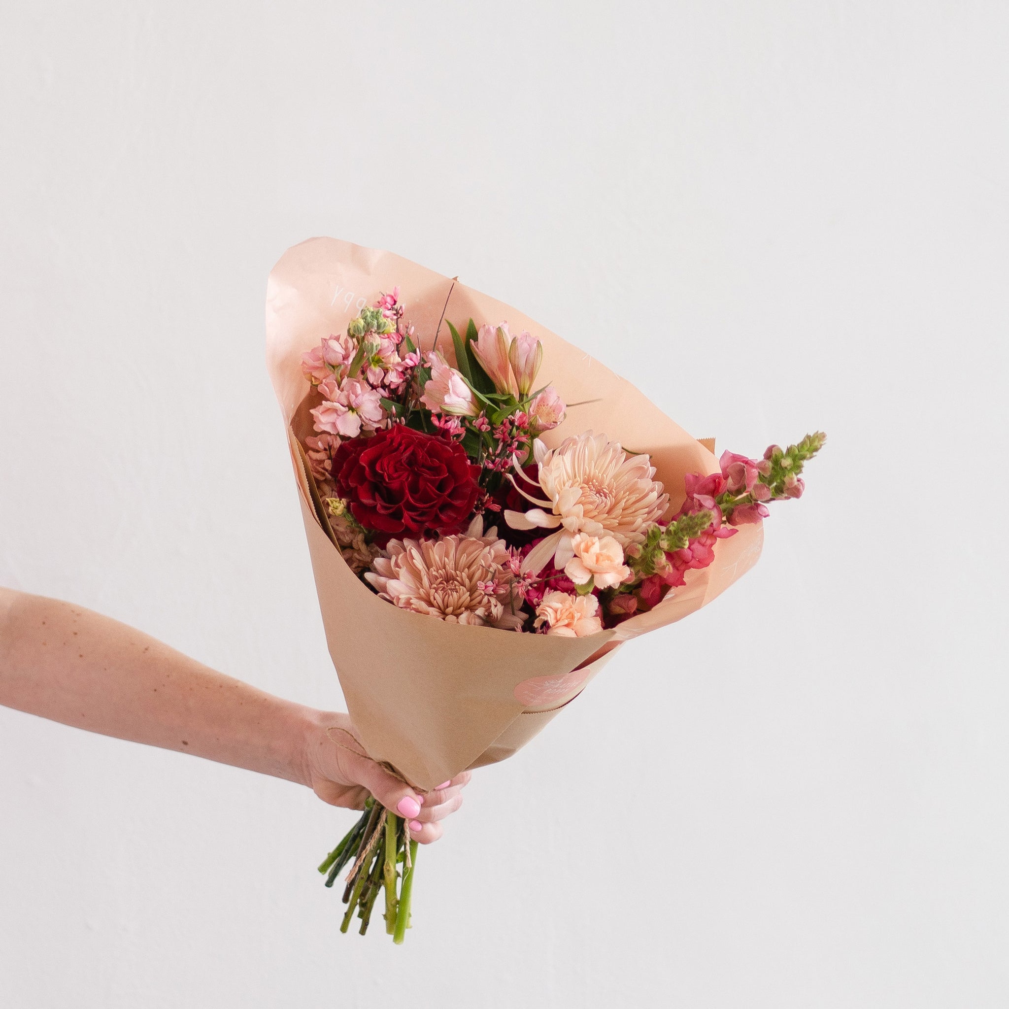 Classic Valentine Flower Bouquet in red, peach, and pink