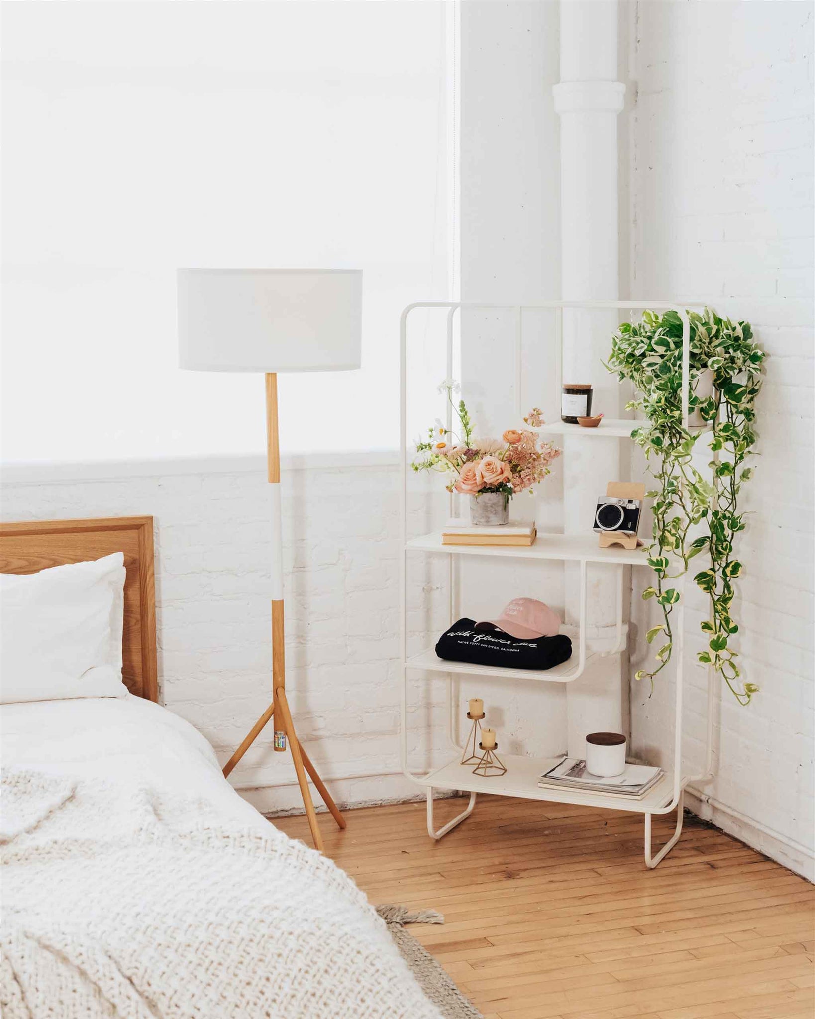 Flower arrangement on a shelf in a bedroom