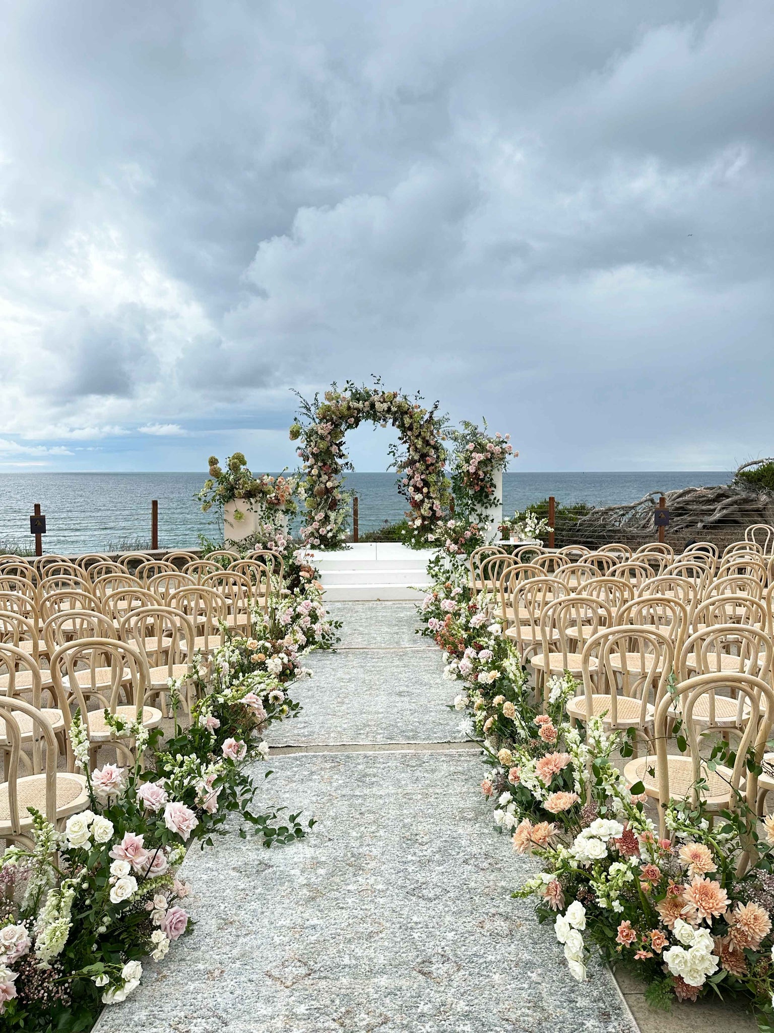 Wedding ceremony flowers with a beach view