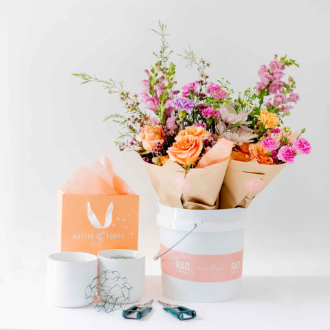 Bucket of flowers, vases, chicken wire, sheers, and Native Poppy gift bag