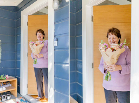 Woman receiving Native Poppy flower wrap at the door