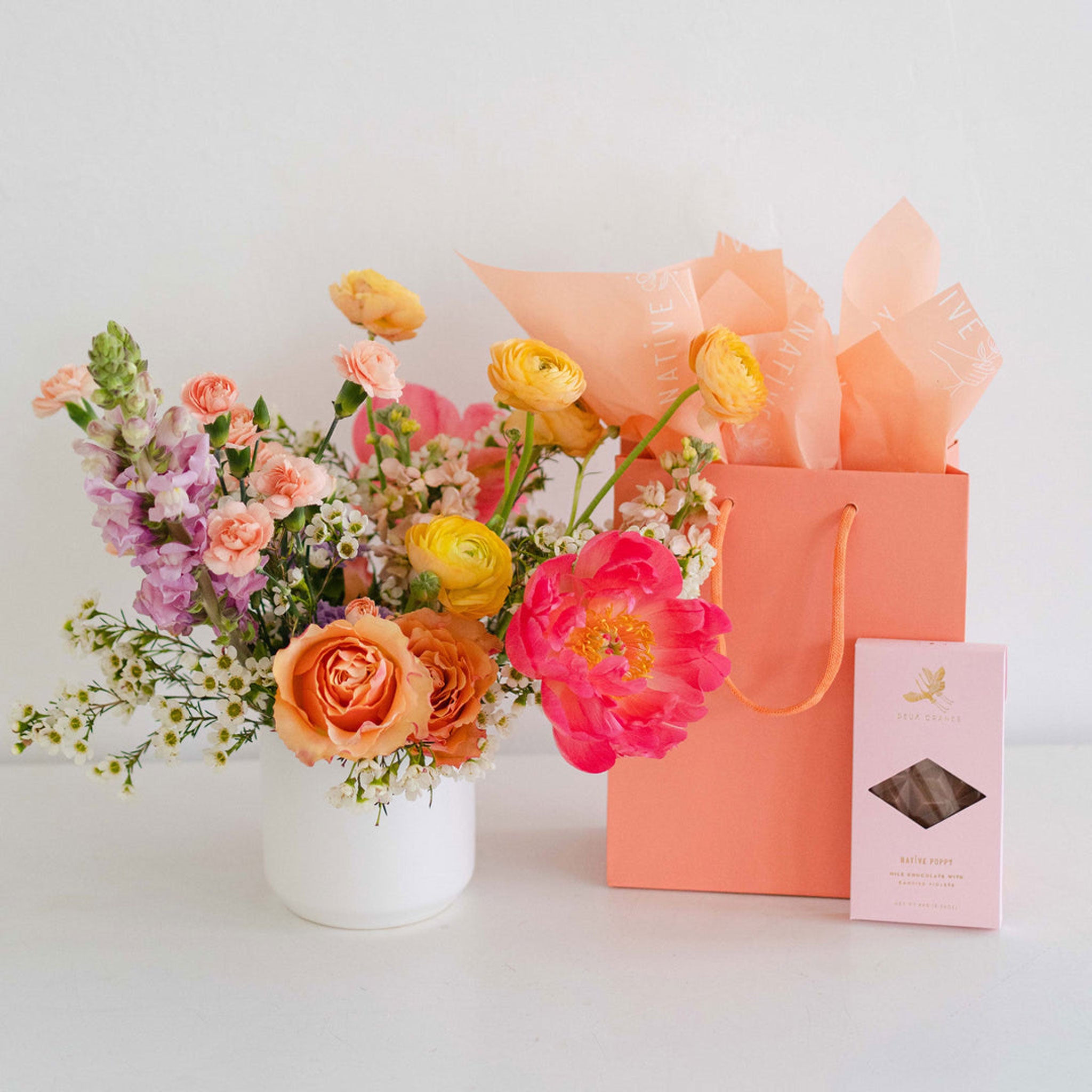 Chocolate gift and fresh flower arrangement