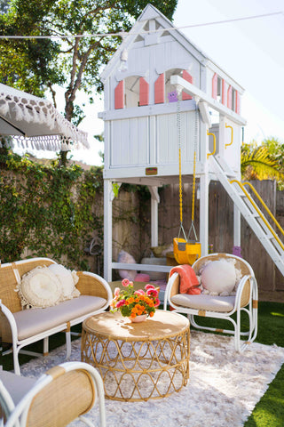 Pink and white play house with lounge setup