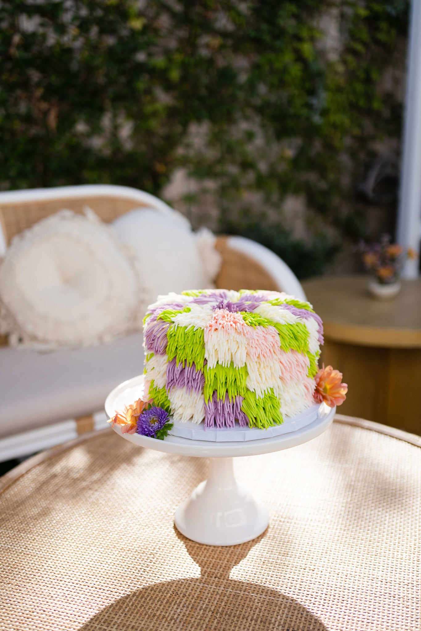 Purple, green, and white frill party cake