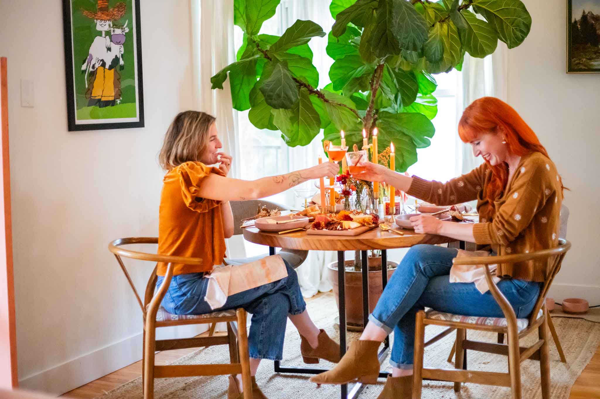 Natalie and Meg eating at a Thanksgiving Table