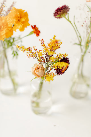 Glass bud vases with Thanksgiving flowers
