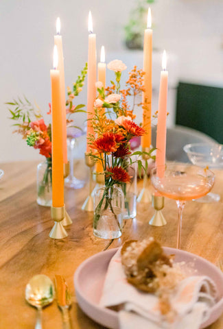 Floral bud vase arrangements styled on a Thanksgiving table