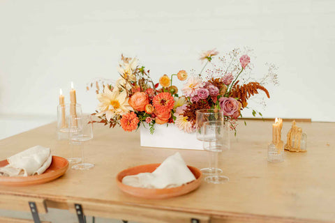 Thanksgiving long and low flower arrangement on dinner table