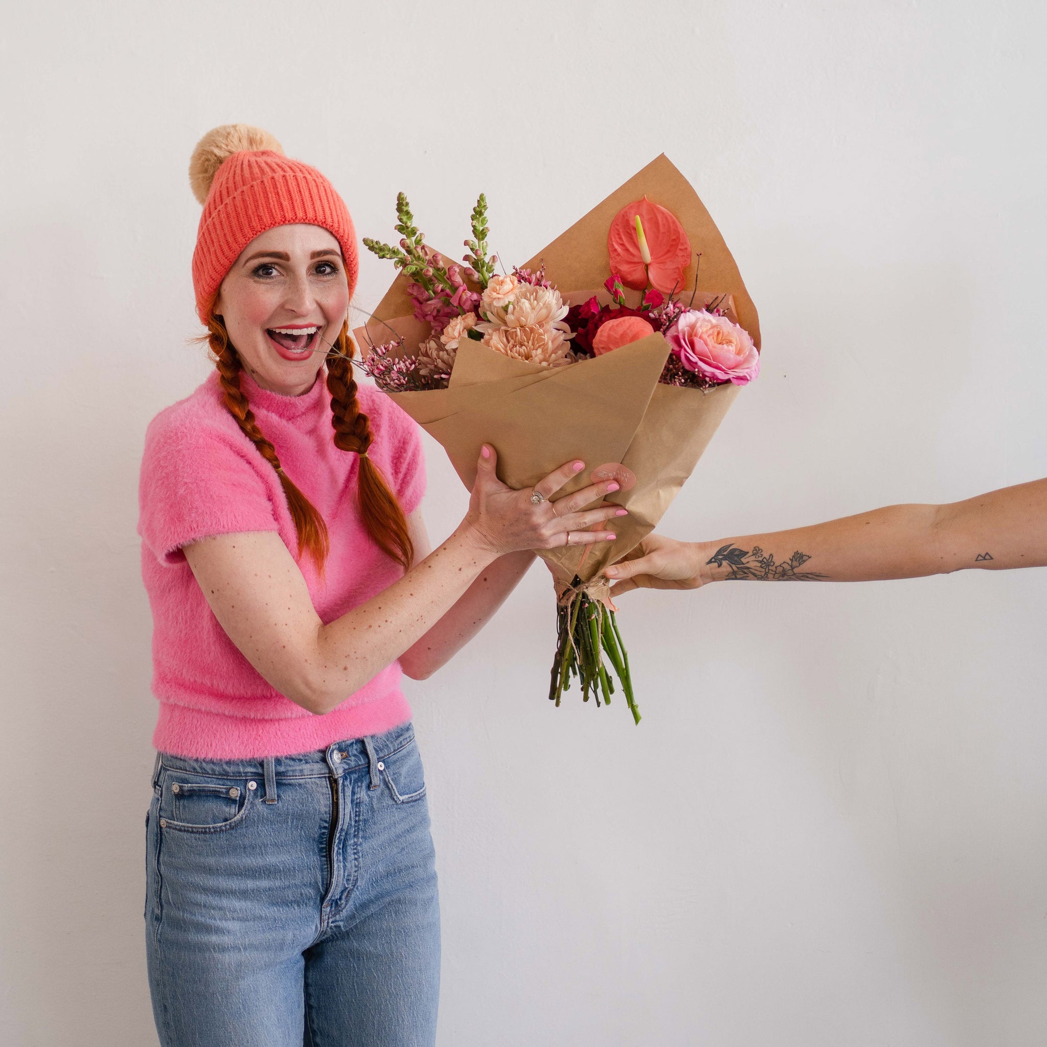 Woman receiving Valentine’s flower bouquet