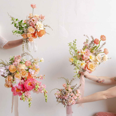 Four hands holding Native Poppy wedding bouquets in varied sizes