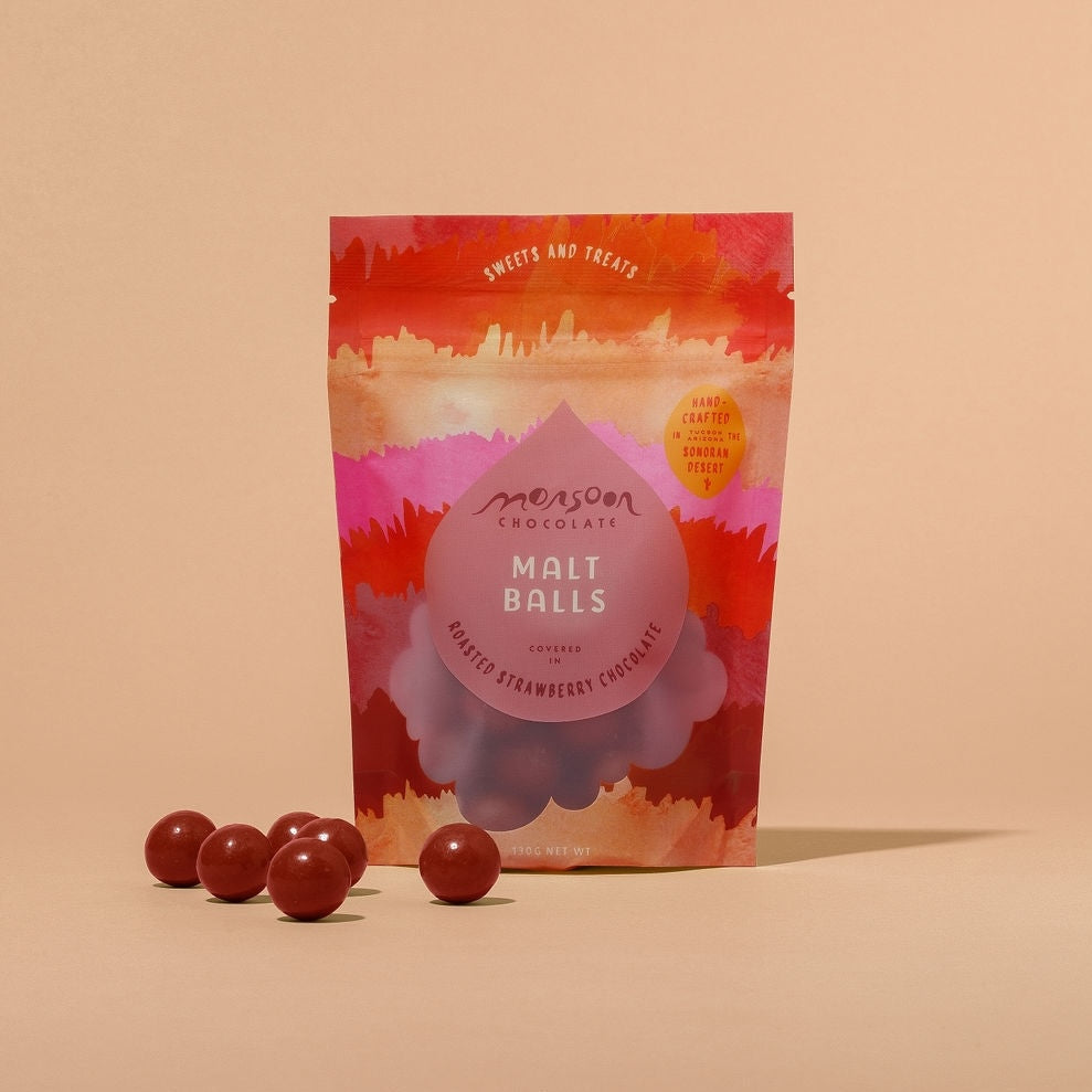 Malt balls covered in roasted strawberry chocolate