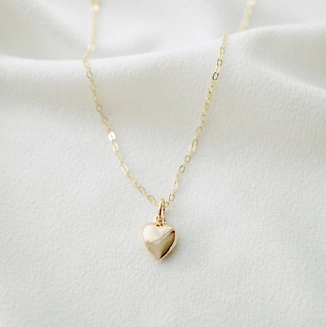 A gold heart shaped necklace