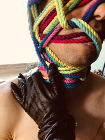 Leather Gloved Hand on Neck, Head wrapped with Emojibator Funfetti Rope