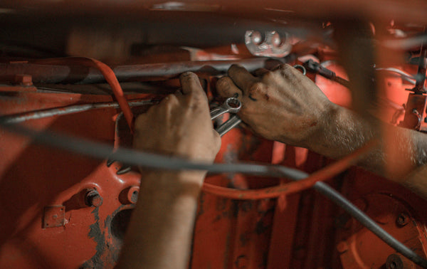 mechanic modifying a car engine