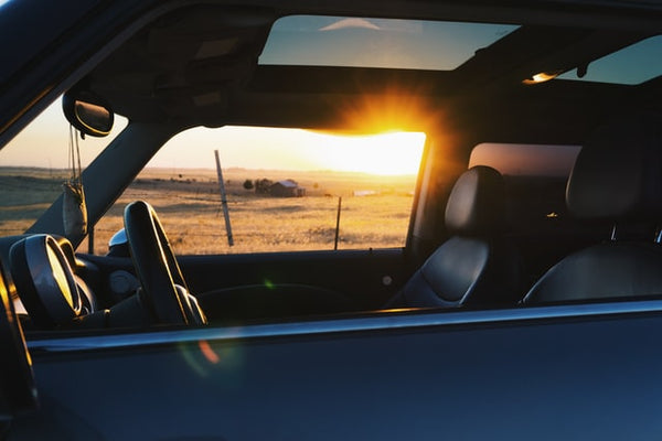 car with sunset in background