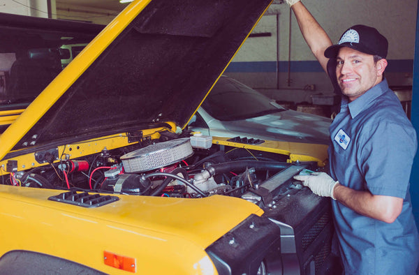 mechanic inspecting the car air recirculation system