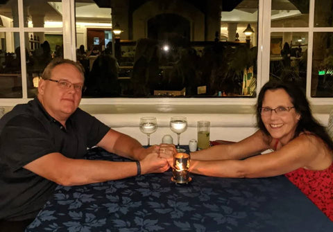 cherylee and darrel at a table