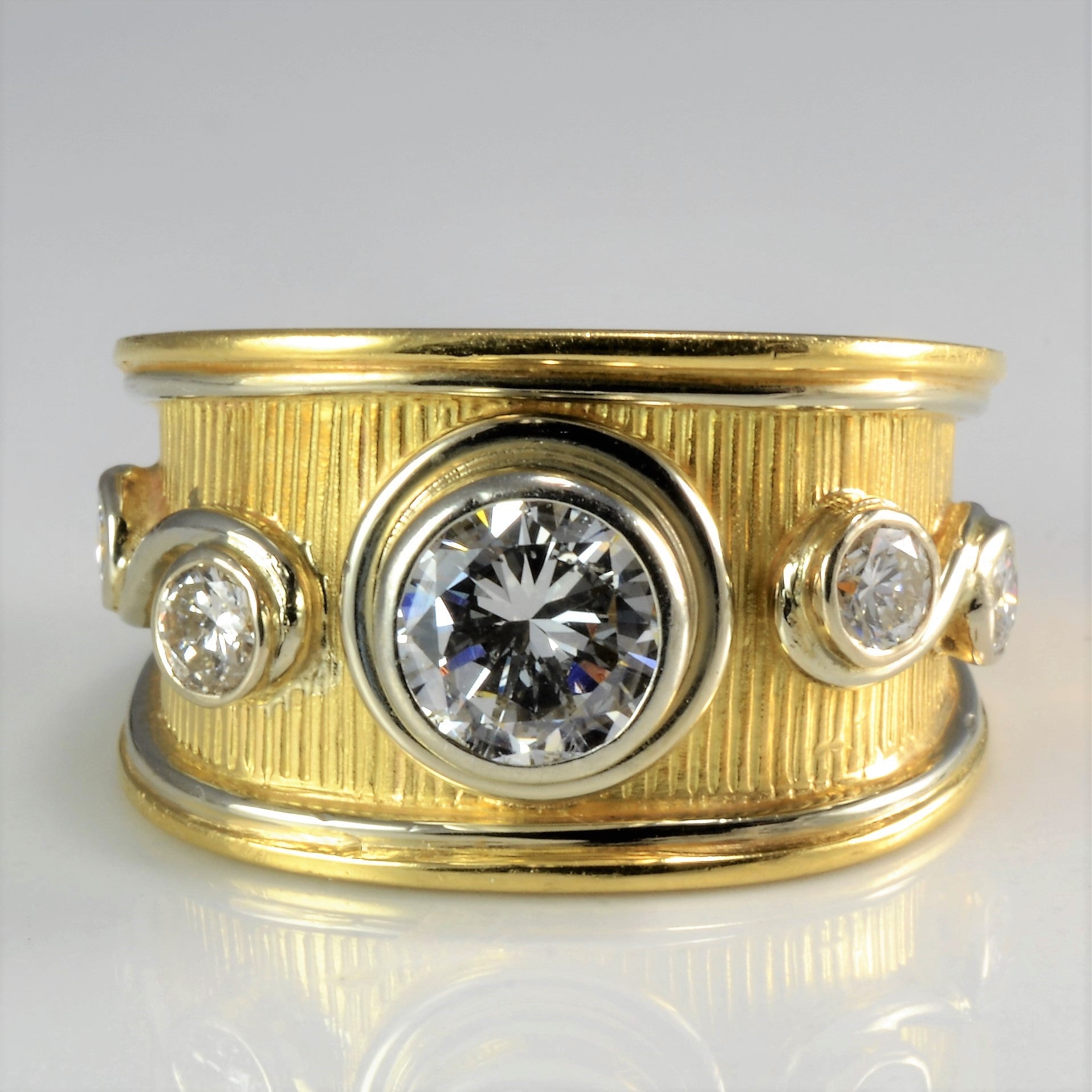 wide gold band with bezel set diamond