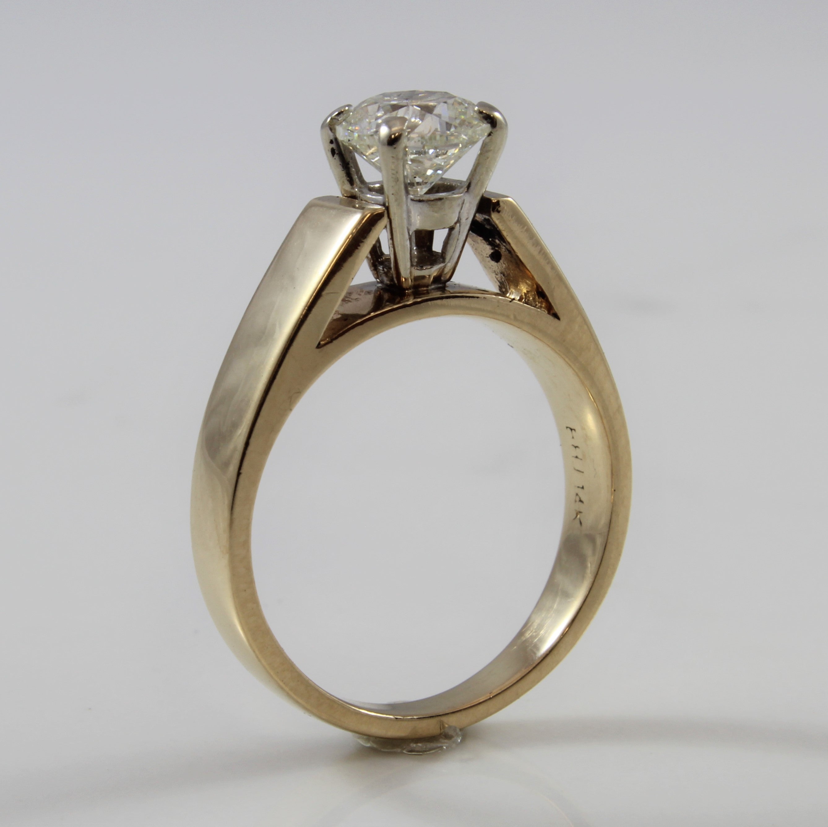 simple gold band solitaire diamond ring