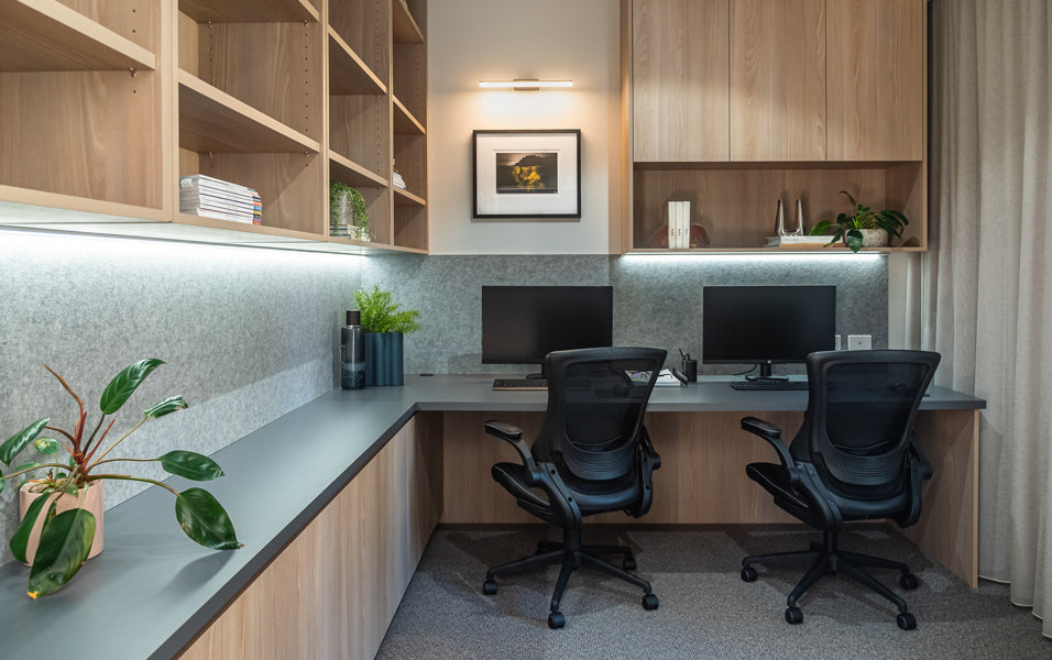 Office with Asan 45 wall light focusing on artwork. Timber cabinetry.