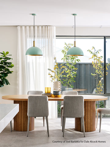 Kann 410 pendants hanging over a dining table