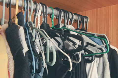 messy closet needing luxury wooden hangers