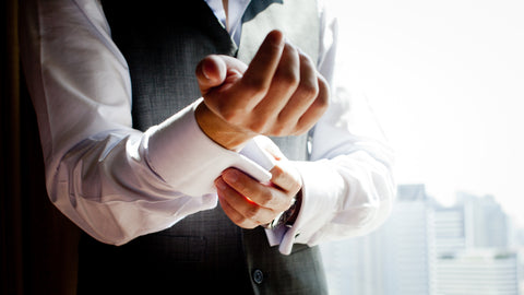 Man getting dressed into suit