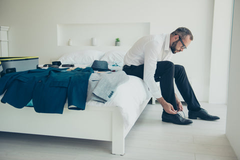 Man trying on dress pants