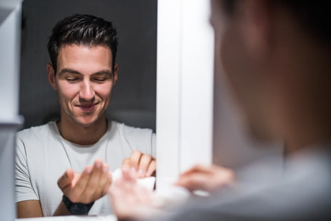 applying aftershave balm