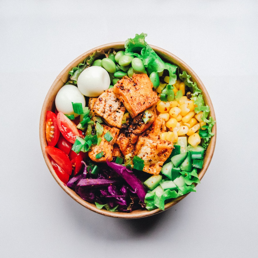 Image of a grain bowl with tofu made with LĒVO herbal infusion.