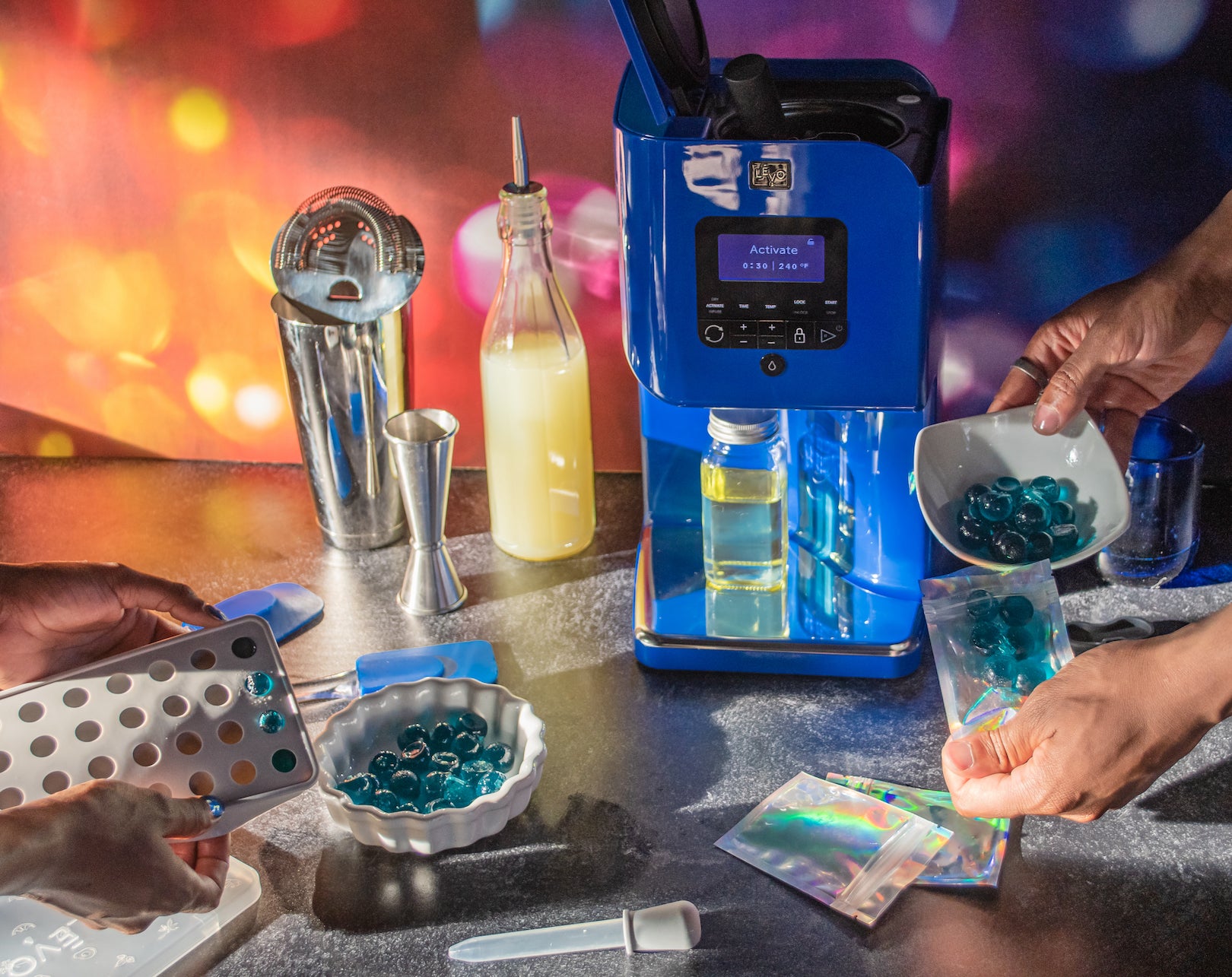 Image of a blue LĒVO II device, used to make infused peanut butter and more.