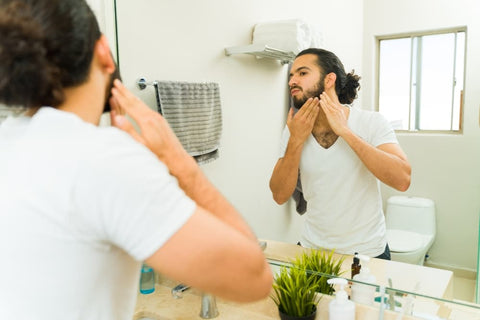 man using DIY beard oil