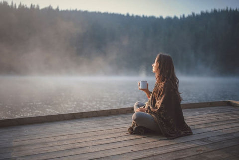 woman relaxing with infused honey tea