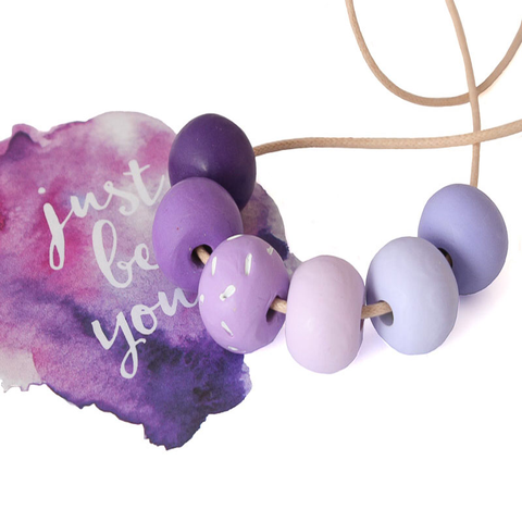 purple long beaded necklace at lottie of london jewellery