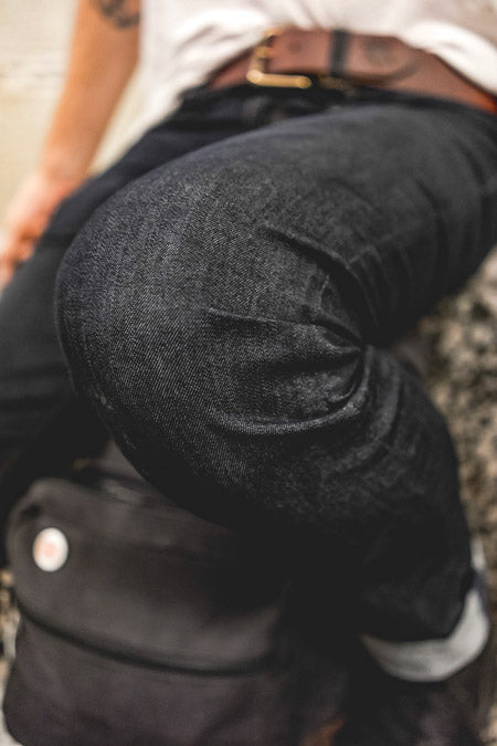 close up on knee to show stretch denim in action