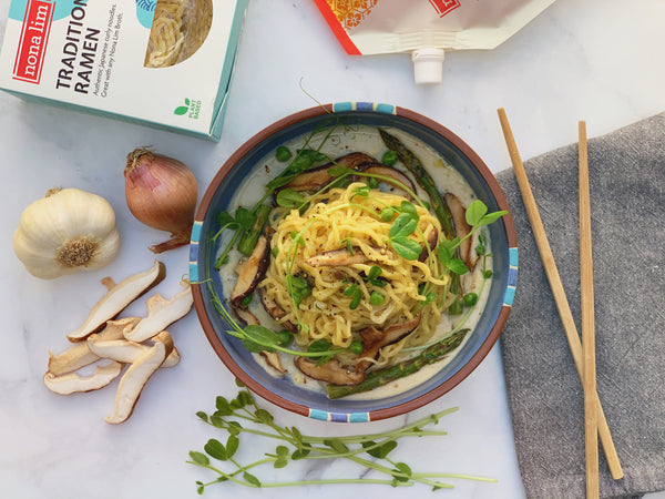 Miso Ramen Alfredo dish with ingredients and chopsticks