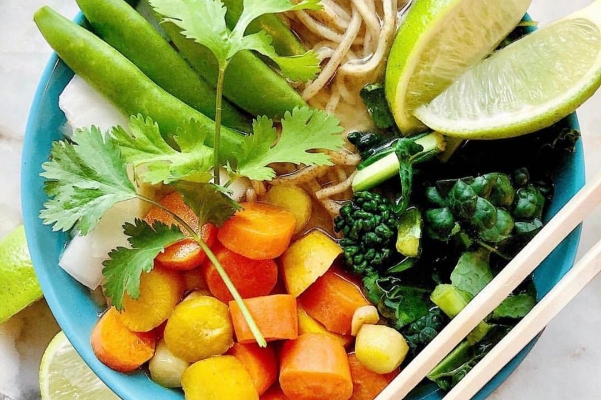 bowl of fresh vegan ramen with rainbow toppings