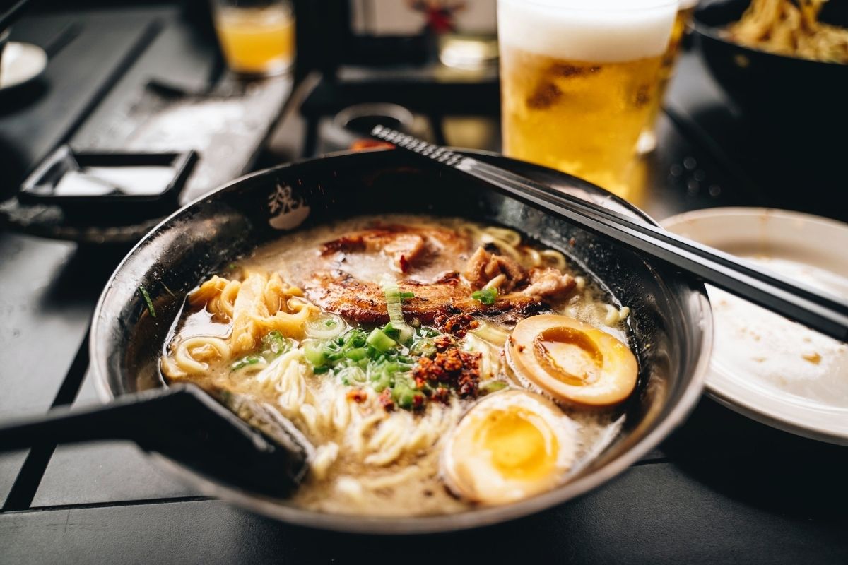 bowl of ramen and beer