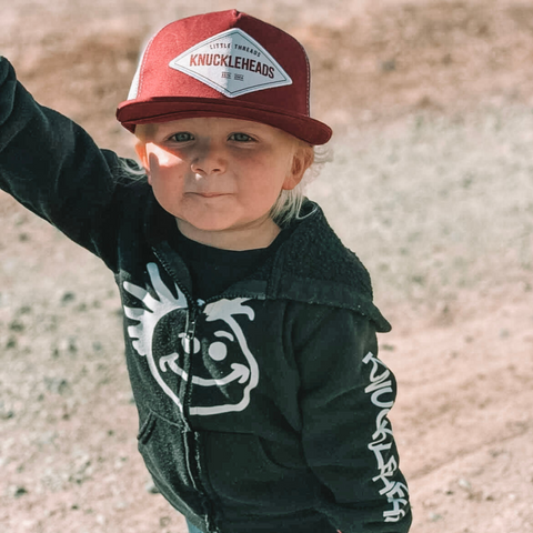 Kid wearing cute snapback hat.