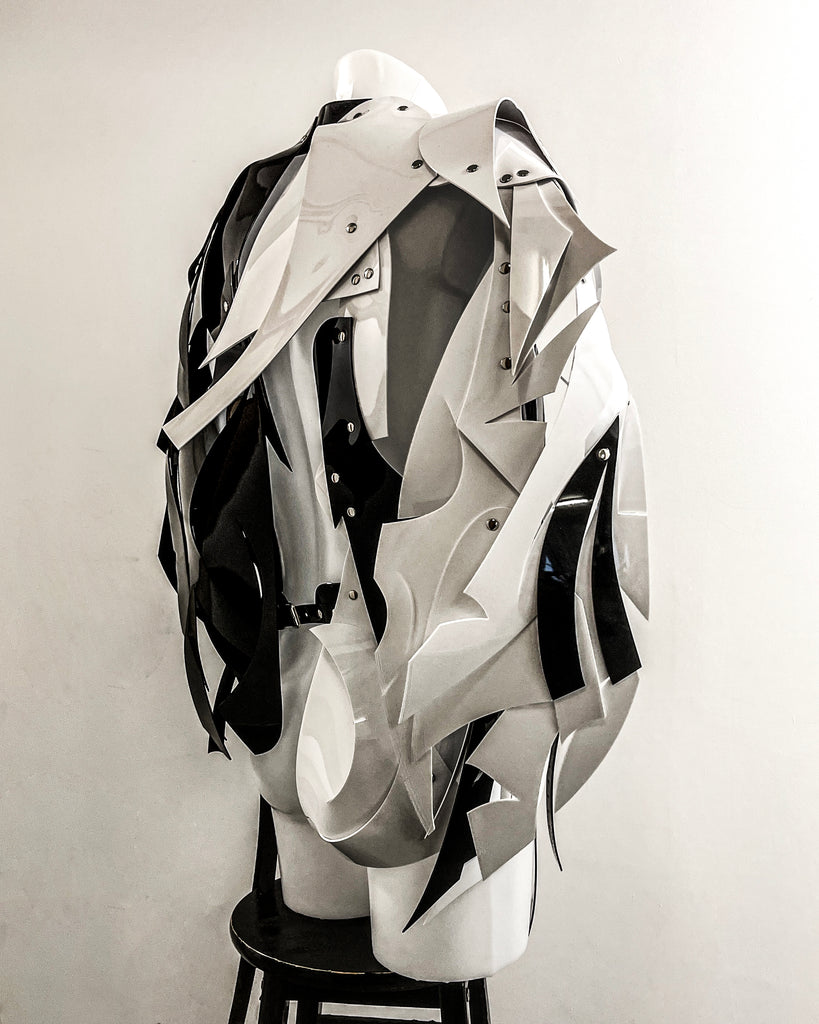 Olli Appleyard wearing Pure Sculpture Asymmetric Jivomir Domoustchiev vegan Jacket