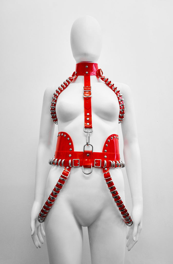 Shaybo Queen of the South wearing Jivomir Domoustchiev Red and Gold multi ring vegan vinyl harness for her Broke Boyz music video Out Now featuring Dream Doll