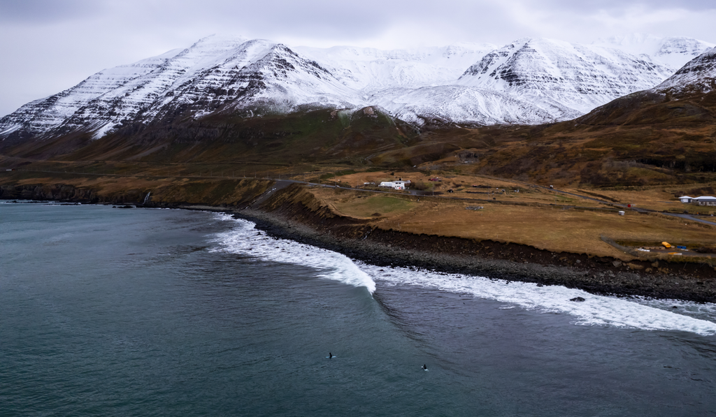 A drone shot of a point break in Iceland