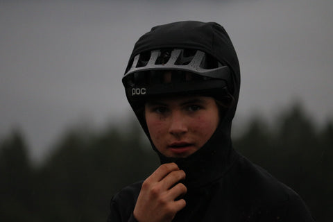 An image of Ross, a young man with a hoodie pulled up over a baseball cap and a jacket zipped up to the top of his neck.