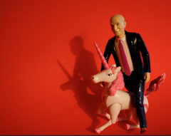 Seth Godin Riding a pink unicorn