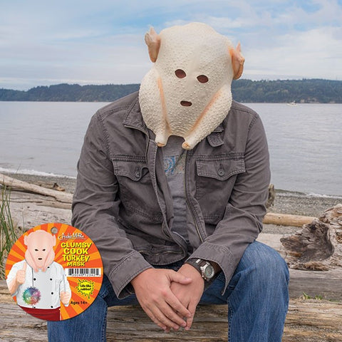 Turkey Mask Scott Heffernan sits on beach