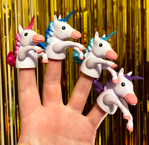 Four unicorn finger puppets in various colors