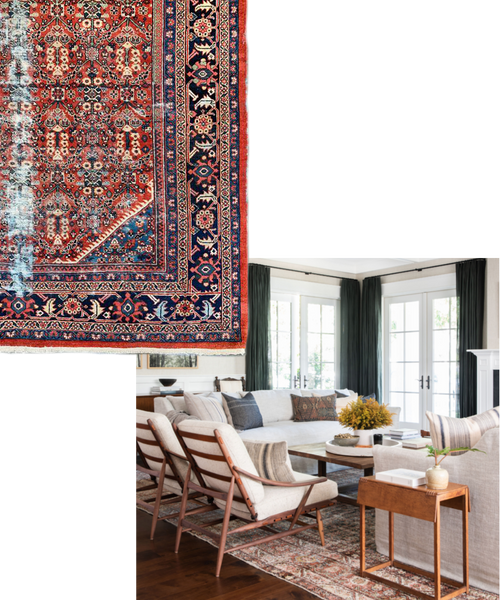 a large living room design by Amber Lewis, with two white linen sofas, two white armchairs with brown wood bones and a large antique rug beneath. 